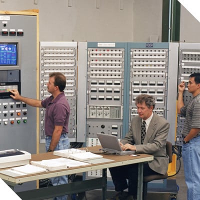 Professionals being trained on control systems at a Petrotech facility 