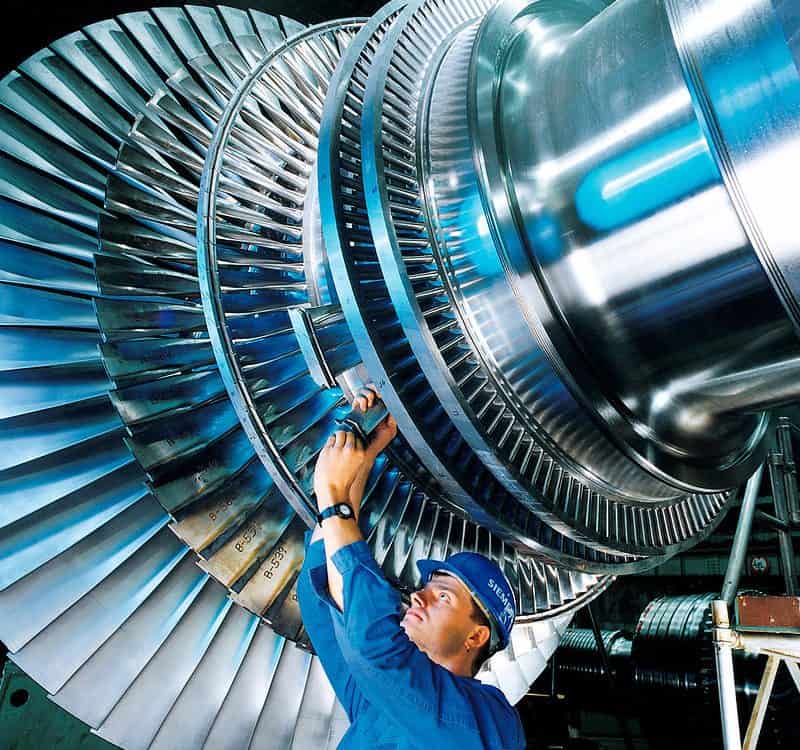 A man working on a steam turbine